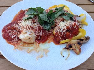 ...smothered in red sauce, mozz, parm, & fresh basil.