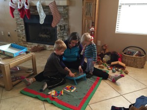 Aunt Laura teaching the boys a game.